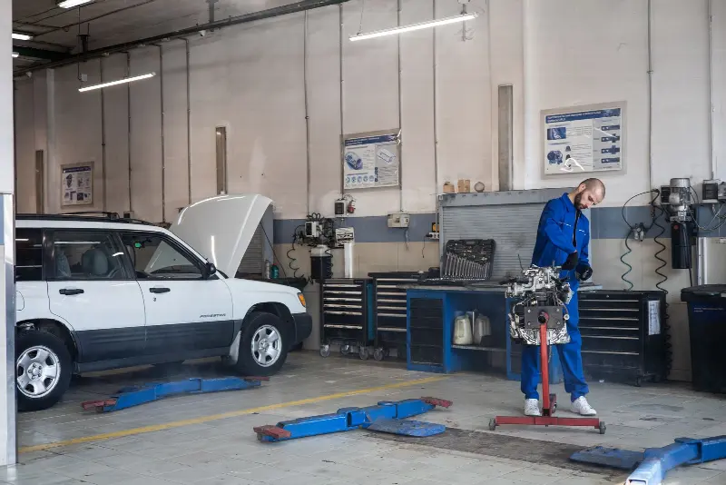 A technician working at a bench in a clean service bay